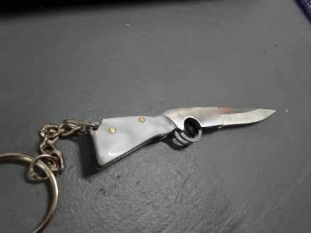 Silver gunshaped keychain knife