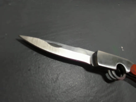 Red-ish gunshaped keychain knife