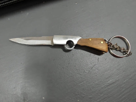 Brown gunshaped keychain knife