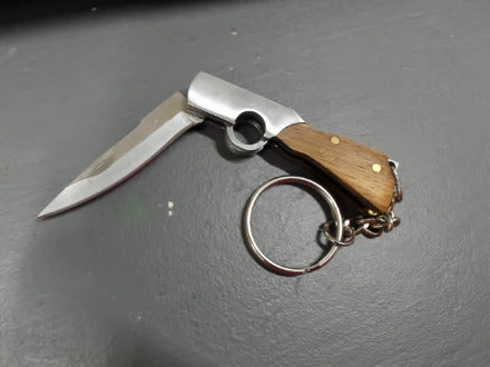 Brown gunshaped keychain knife