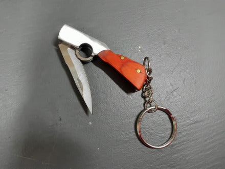Red-ish gunshaped keychain knife